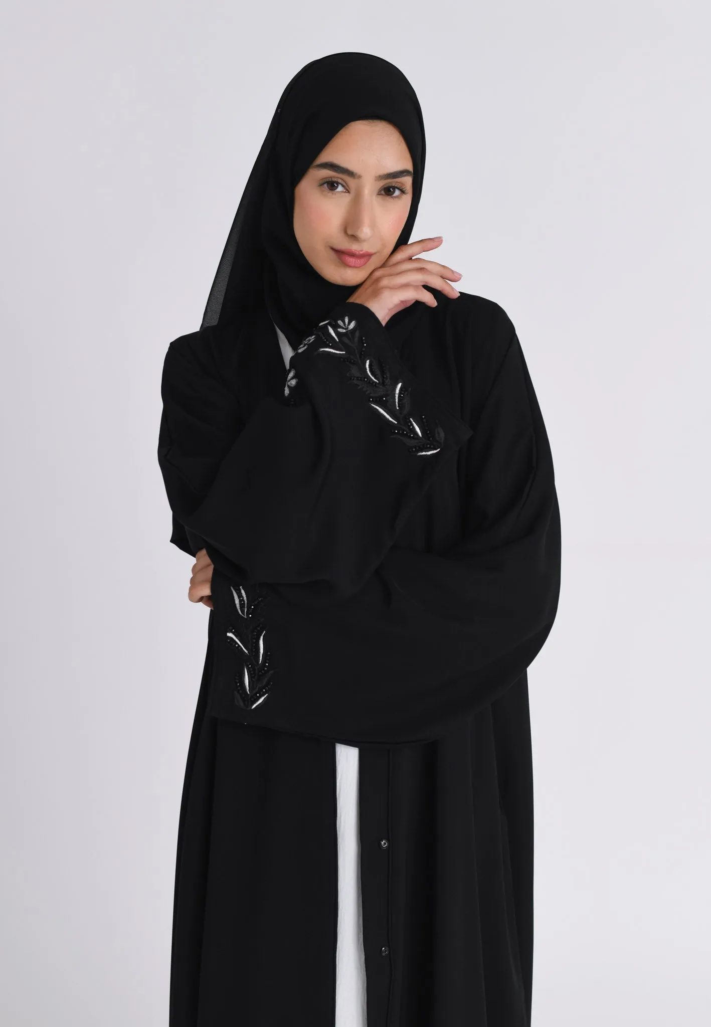 Elegant Noir Embroidered Abaya With Minimal Embellishments