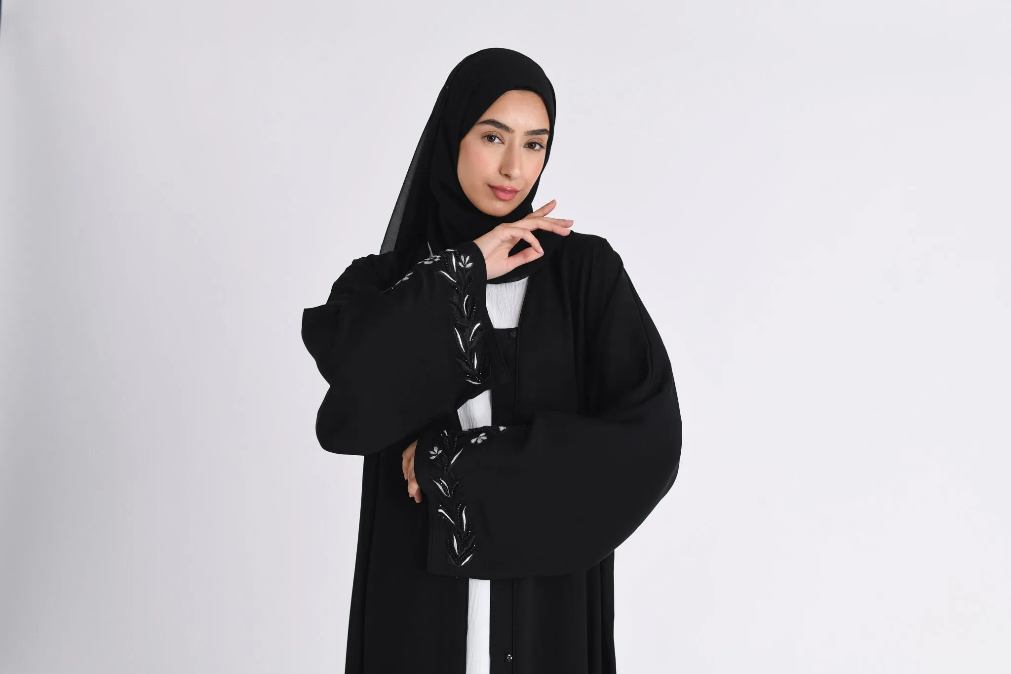 Elegant Noir Embroidered Abaya With Minimal Embellishments