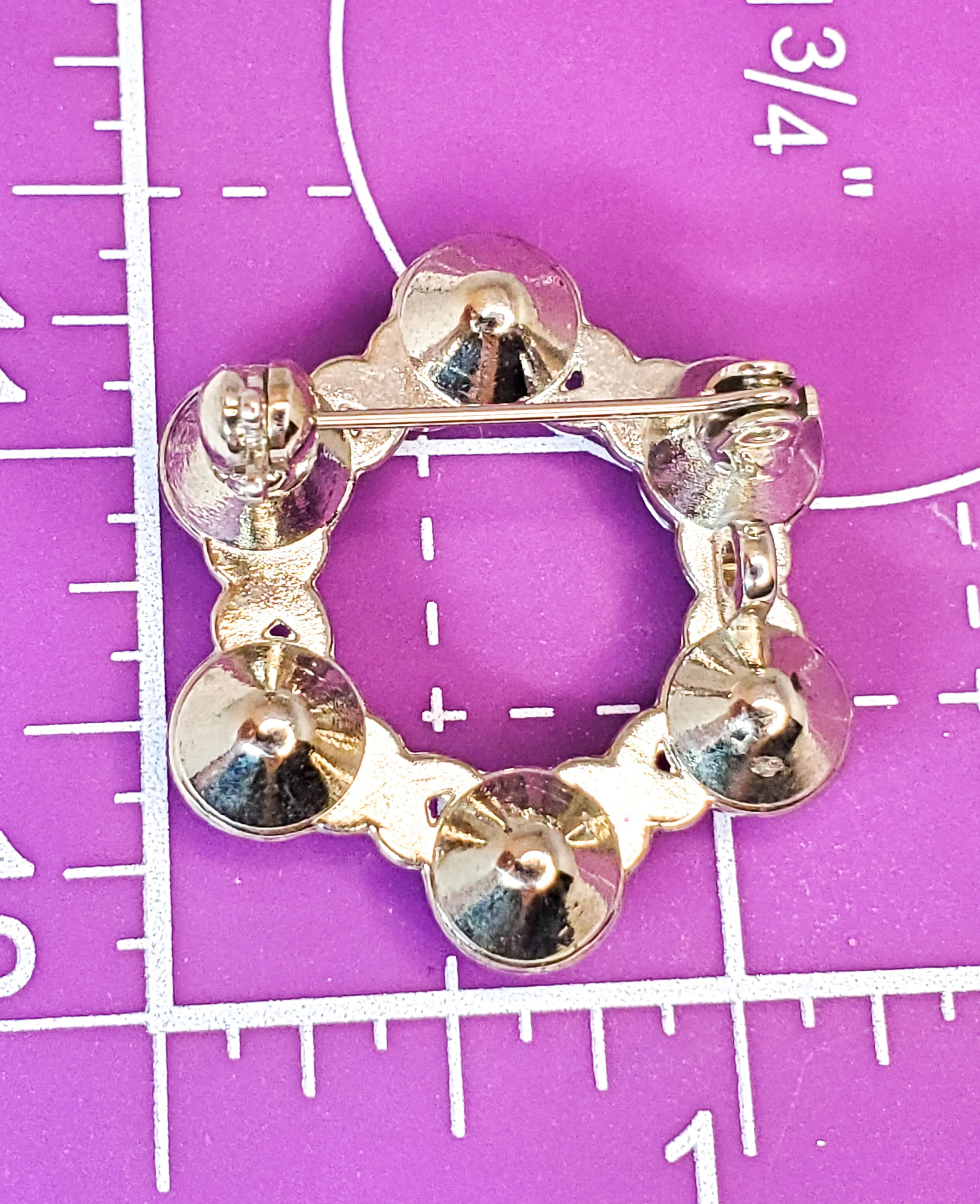 Pave set rhodium plated bright clear rhinestone circle brooch