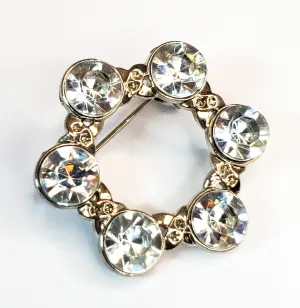 Pave set rhodium plated bright clear rhinestone circle brooch