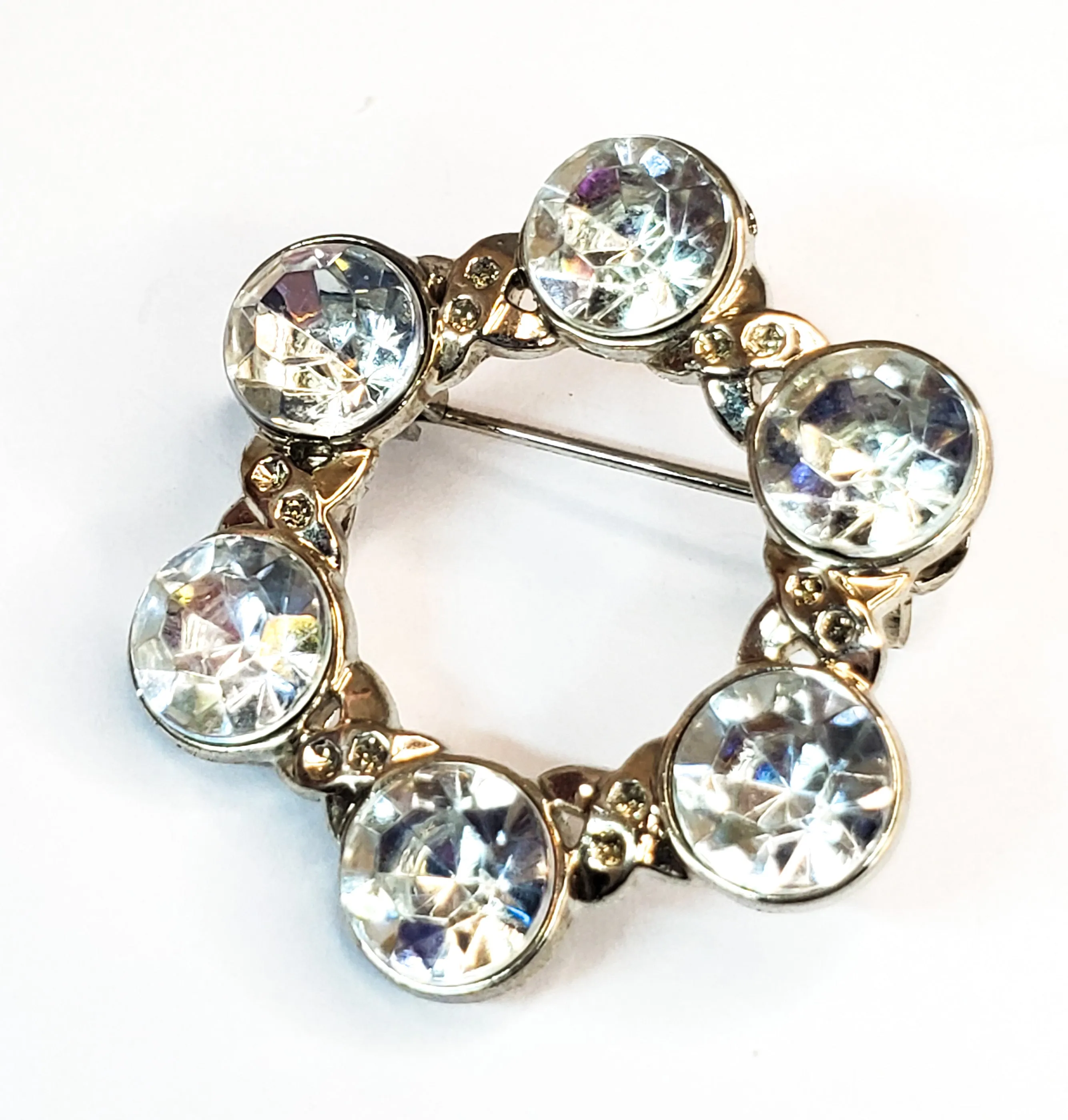 Pave set rhodium plated bright clear rhinestone circle brooch